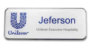 A silvered plastic executive name badge with the leyend: "Jeferson"